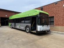 a new green GoTriangle bus