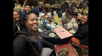 a group of GoTriangle employees at a Safety Star celebration at dinner
